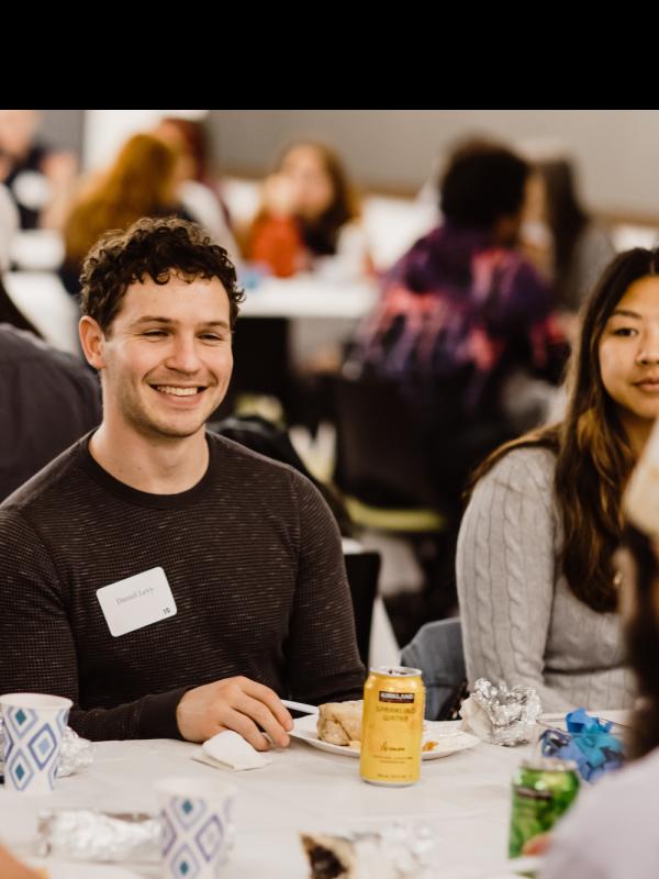 Students talking together over dinner
