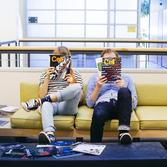 Students reading Cell Magazine