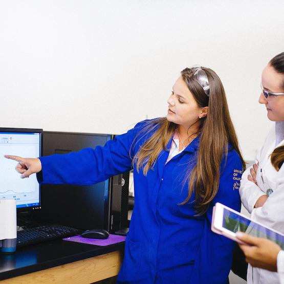 Professors and students in a lab